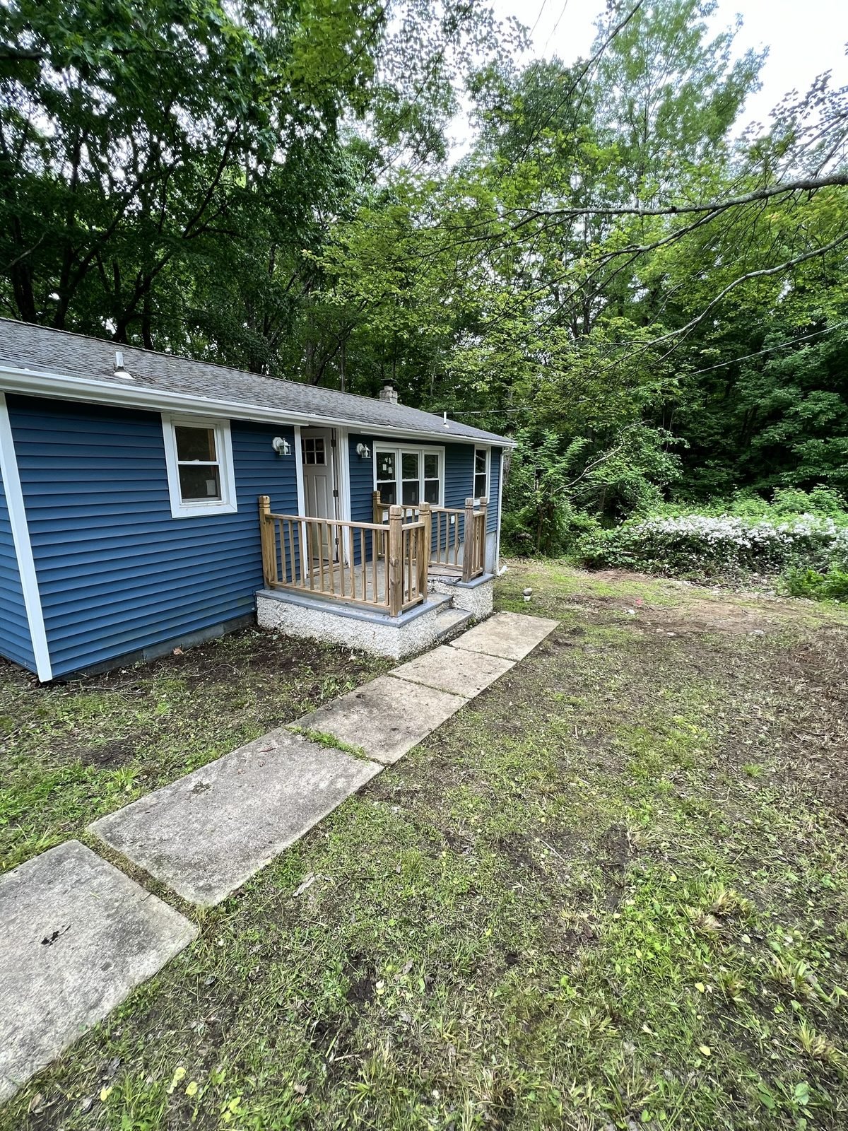 Same property after: lines buried, lawn grown in, house finished